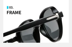 Detail shot of black sunglasses frame hinge with decorative silver arrow metal stud