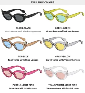 Detail view of cat eye sunglasses in six trendy colors with decorative demon horn accents
