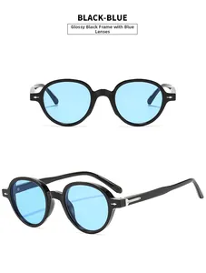Detail view showing black round sunglasses frame with blue lenses and silver diamond studs