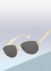 Detail of gold metal frame aviator sunglasses with soft silicone nose pads and hinges