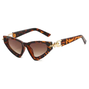 Vintage tortoiseshell cat-eye sunglasses with gradient lenses and gold arrow metal accents