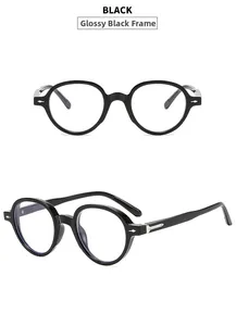 Close-up of retro round black sunglasses with silver arrow metal detail on side temples
