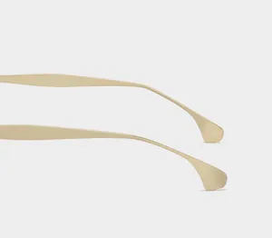 Detail of curved metal sunglasses temples with non-slip design and polished finish