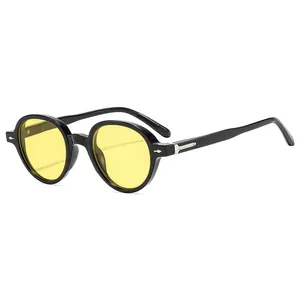 Retro round black sunglasses with vibrant yellow lenses and silver diamond metal rivets