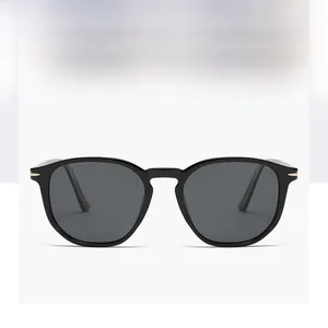 Detail view of stylish polarized sunglasses with black frames and golden accents