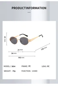 Vue détaillée de lunettes de soleil ovales vintage avec branches gravées et verres UV400