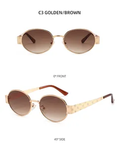 Détails de lunettes de soleil ovales dorées avec gravure rose et verres dégradés bruns