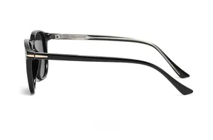 Side view of retro polarized sunglasses with black frames and gold metal accents