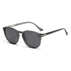 Vintage polarized sunglasses with translucent grey frames and gold arrow accents