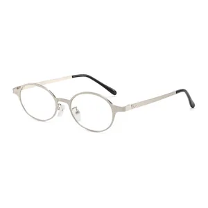Vintage oval silver metal sunglasses with black temples for a retro fashion look