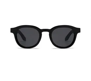 Front close-up view of vintage round black sunglasses with high-quality dark lenses