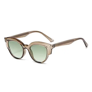 Fashionable cat-eye TR90 sunglasses with champagne frames and light green lenses