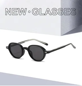 Detailed side view of black oval sunglasses with silver arrow accents and TR90 frame