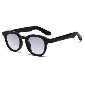 Classic black oval sunglasses with light purple gradient lenses and silver rivet studs