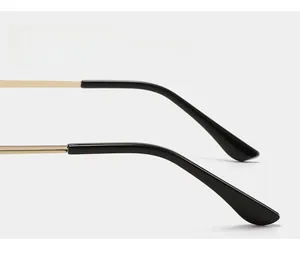 Close-up of golden metal temple with black curved anti-slip tips for stylish sunglasses