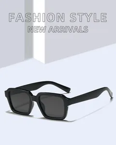 Close-up of black square frame sunglasses with fashion style and dark lenses on blue background