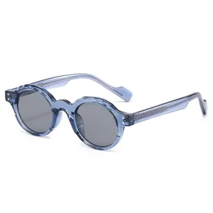 Retro TR90 round sunglasses in translucent light blue with thick frames and grey lenses