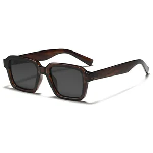 Retro square tortoiseshell sunglasses with dark lenses and wide temples on white background