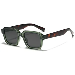 Vintage square sunglasses with translucent olive green frames and tortoiseshell temples