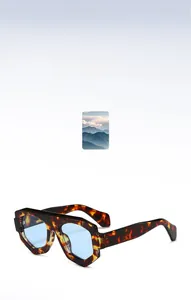 Détail macro de lunettes de soleil en écaille au design hexagonal et verres bleus clairs