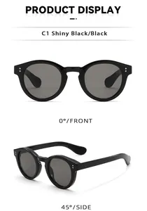 Macro detail of shiny black round sunglasses frame with silver rivet studs decor