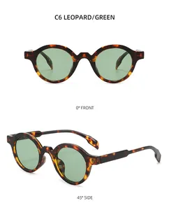 Detail view of leopard print round sunglasses with green lenses from front and side angles