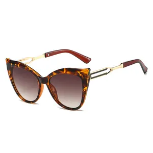 Lunettes de soleil œil de chat vintage pour femmes avec monture écaille et branches dorées