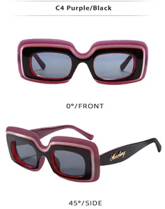 Détails de lunettes de soleil carrées rétro violettes et noires avec logo doré sur les branches