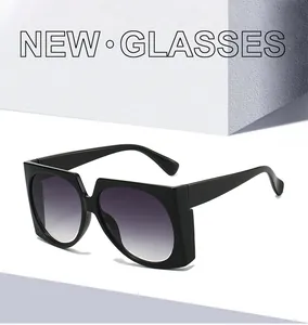 Detailed view of square frame sunglasses with black frames and purple gradient lenses