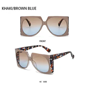 Detail view of khaki square sunglasses with leopard temples and brown-blue gradient lenses