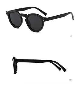 Detailed view of black round vintage sunglasses with silver metal rivets and side temples
