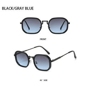 Détail de lunettes de soleil géométriques noires avec verres dégradés gris-bleu en vues frontale