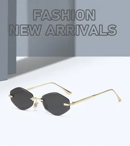 Detailed close-up of rimless geometric grey lenses with elegant gold metal temples
