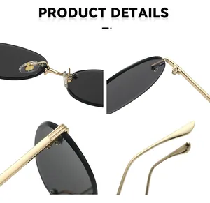 Detail view of oval rimless sunglasses featuring gold metal hinges and soft nose pads