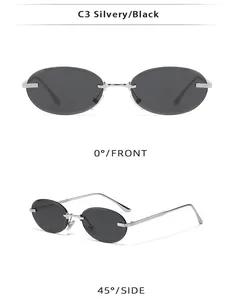 Detail view of oval rimless sunglasses with silver metal frame and dark grey lenses