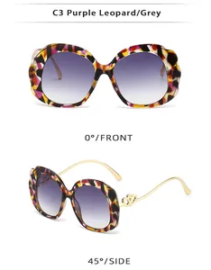 Detail view of purple leopard oval sunglasses with golden double heart metal temple decor