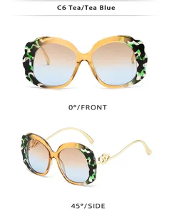 Detailed view of oval sunglasses with wavy petal frames and double heart metal temples