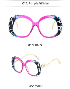 Detail of C12 purple tortoiseshell oval frames with gold double heart metal hinges