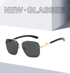 Detailed close-up of golden metal bridge and silver rivet on square aviator sunglasses