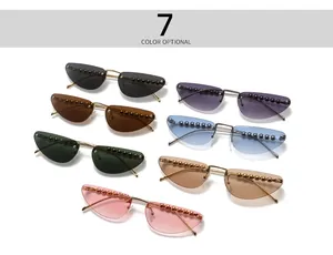 Detailed display of cat-eye rimless sunglasses with pearl trim in seven vibrant colors