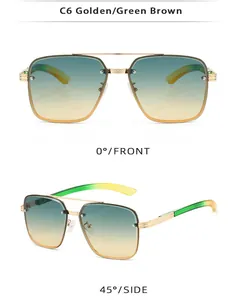 Detail view of golden metal aviator sunglasses with green-brown gradient lenses and hinges