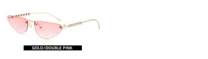 Close-up of gold metal temples with pearl accents on cat-eye sunglasses with pink lenses