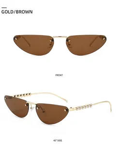 Detail view of cat eye sunglasses with gold frames and pearl-embellished temples