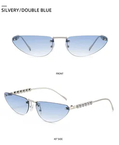 Detail view of cat eye sunglasses with silver frames, blue lenses and pearl temple accents