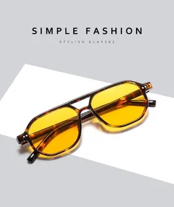 Detail of tortoise frame aviator sunglasses with yellow lenses and double bridge design