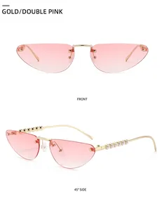 Cat eye frameless sunglasses with pink gradient lenses and pearl-embellished temples