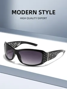 Detail of fashion sunglasses featuring rhinestone-encrusted floral temples and gradient lenses