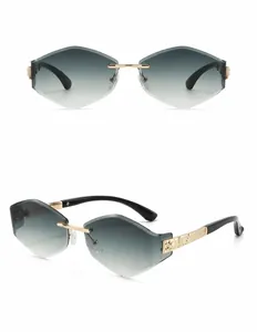 Detail of rimless gold metal sunglasses with double green gradient lenses at a 45-degree angle