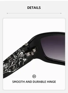 Detail of durable metal hinge and silver floral pattern on black oversized sunglasses