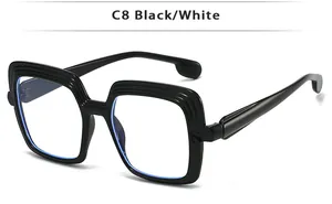 Detail view of stylish square black eyeglass frame with layered wavy edge design